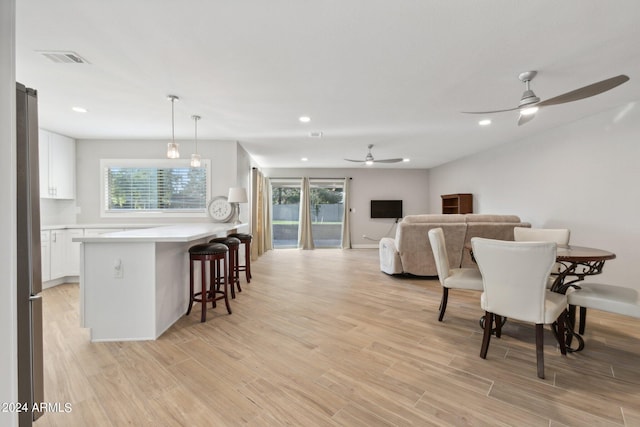 dining space with recessed lighting, light wood-style flooring, visible vents, and ceiling fan