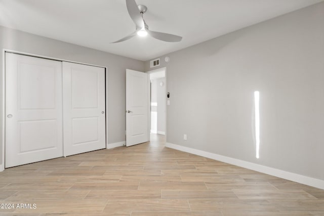 unfurnished bedroom featuring a closet, ceiling fan, and light hardwood / wood-style floors