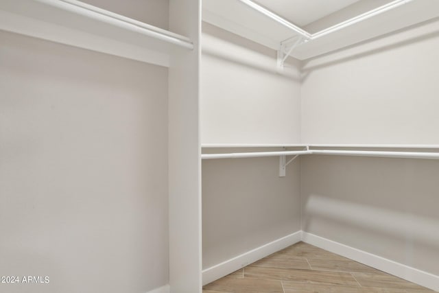 spacious closet featuring wood tiled floor
