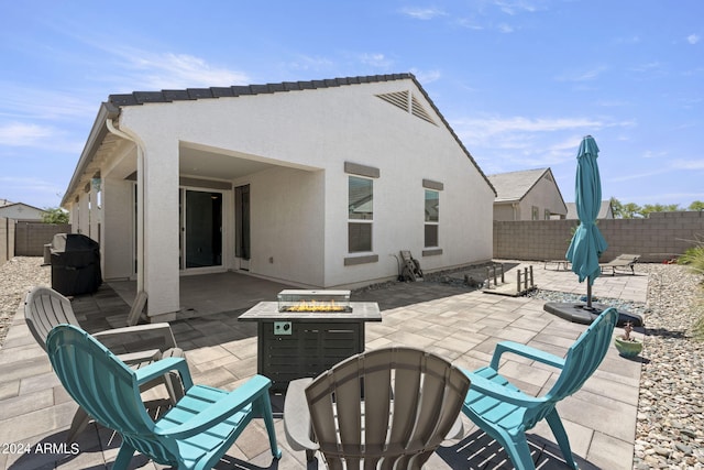 view of terrace featuring a fire pit