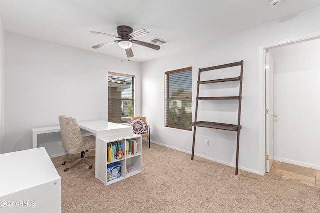 office space featuring ceiling fan and light colored carpet