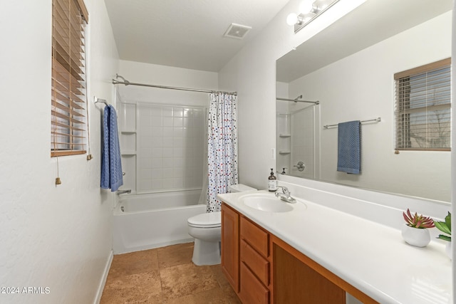 full bathroom with shower / tub combo, vanity, and toilet