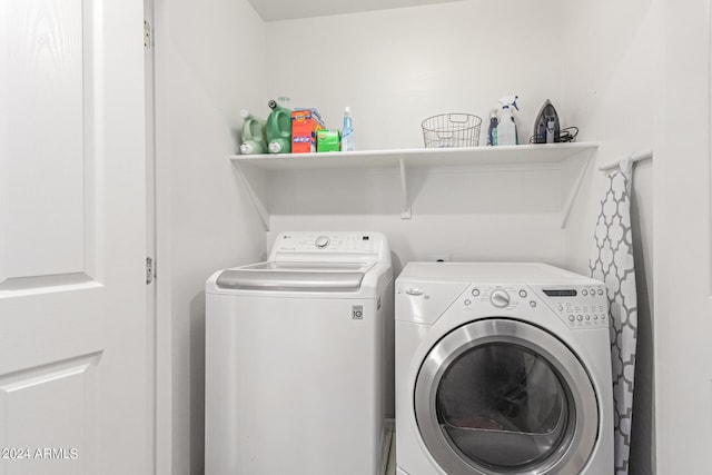 washroom featuring washing machine and dryer