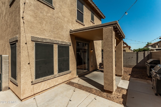 rear view of house featuring a patio