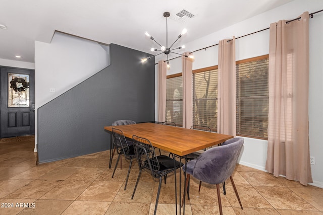 dining area featuring a chandelier