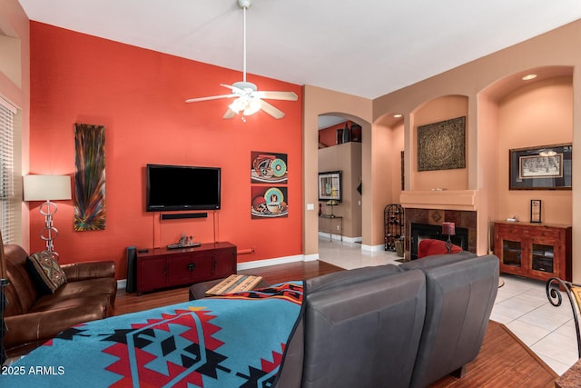6531 E Star Valley St, Mesa, AZ 85215 - living room with wood finished floors, a fireplace, baseboards, and ceiling fan