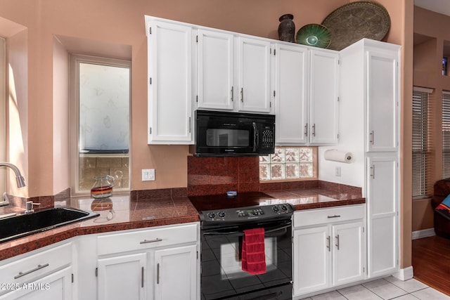 6531 E Star Valley St, Mesa, AZ 85215 - kitchen featuring black appliances, white cabinets, a sink, and light tile patterned flooring