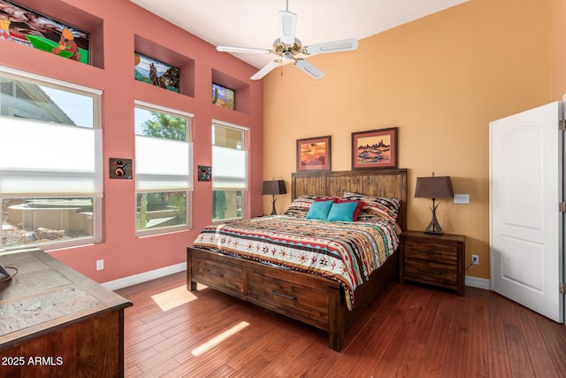 6531 E Star Valley St, Mesa, AZ 85215 - bedroom featuring a towering ceiling, baseboards, and wood finished floors