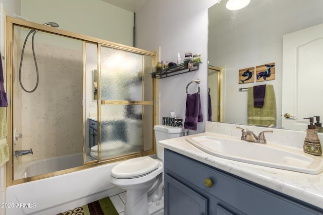 6531 E Star Valley St, Mesa, AZ 85215 - full bathroom featuring toilet, tile patterned floors, bath / shower combo with glass door, and vanity