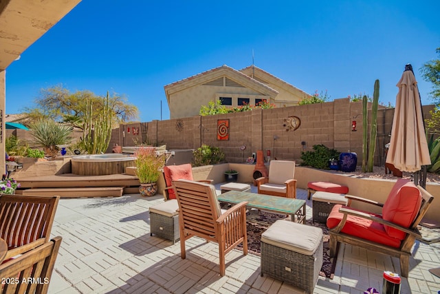 6531 E Star Valley St, Mesa, AZ 85215 - view of patio / terrace featuring a fenced backyard and a hot tub