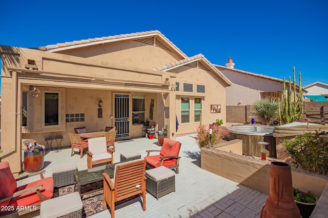 6531 E Star Valley St, Mesa, AZ 85215 - rear view of property with an outdoor hangout area, fence, stucco siding, a patio area, and a hot tub
