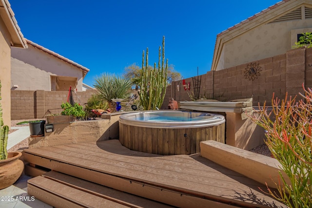6531 E Star Valley St, Mesa, AZ 85215 - deck featuring a hot tub and a fenced backyard