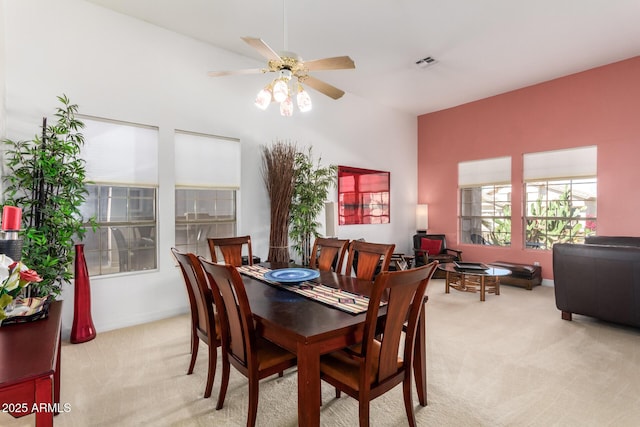 6531 E Star Valley St, Mesa, AZ 85215 - dining space featuring light carpet, ceiling fan, visible vents, and baseboards