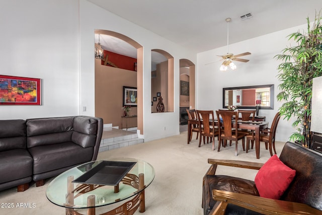 6531 E Star Valley St, Mesa, AZ 85215 - living area featuring arched walkways, carpet floors, ceiling fan with notable chandelier, and visible vents