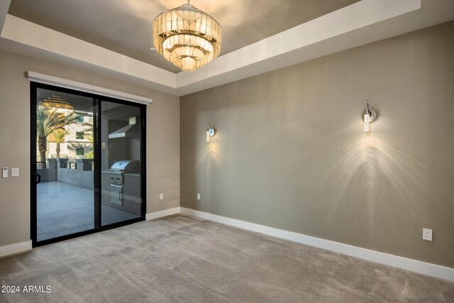 bathroom with vanity, a chandelier, and a shower with shower door