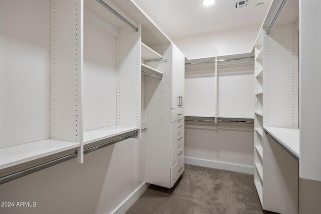 laundry area featuring washing machine and clothes dryer and cabinets