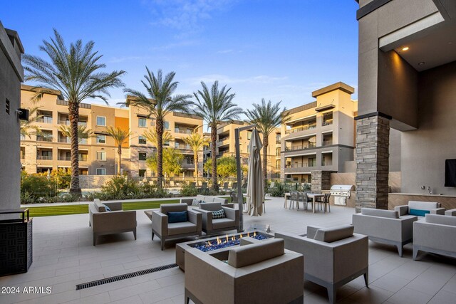 surrounding community featuring a lawn, a patio, and an outdoor living space