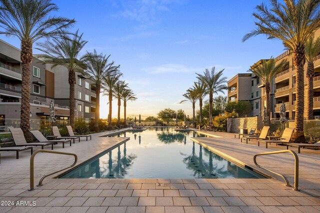 view of swimming pool with a community hot tub and a patio