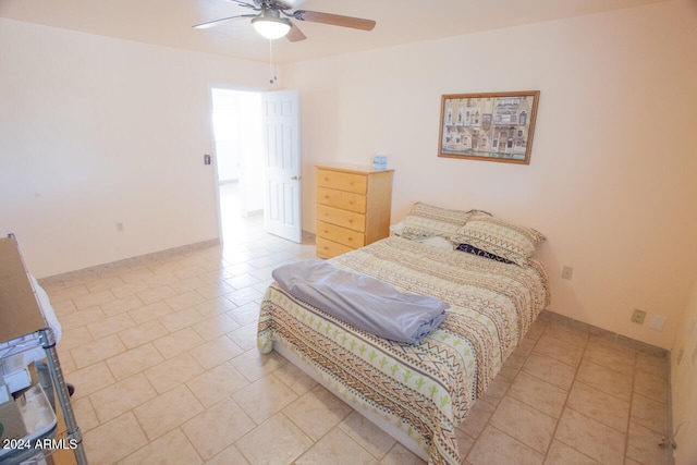 bedroom featuring light tile patterned floors and ceiling fan