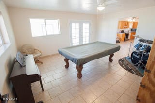 rec room featuring light tile patterned floors, pool table, and ceiling fan