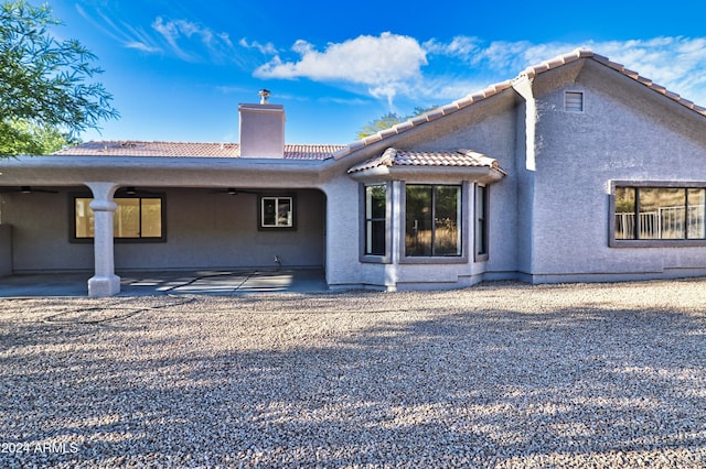 back of property featuring a patio