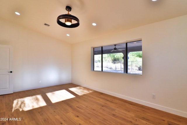 spare room with wood-type flooring