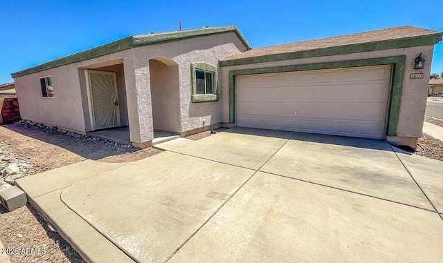1670 W Bitter Orange St, Tucson, AZ 85705 - view of front of home with concrete driveway and stucco siding
