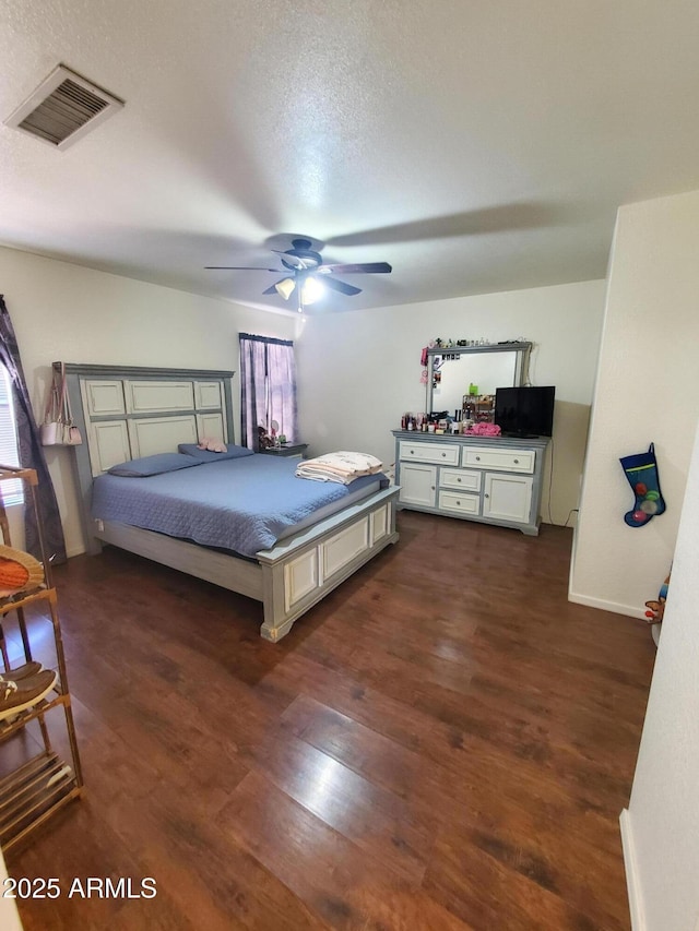 1670 W Bitter Orange St, Tucson, AZ 85705 - bedroom with dark wood-style flooring and ceiling fan