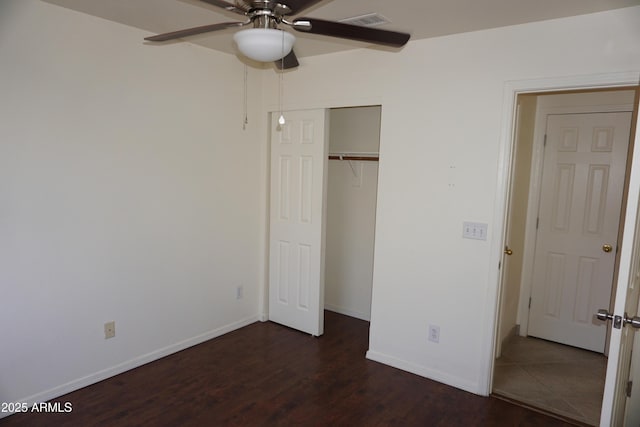 1670 W Bitter Orange St, Tucson, AZ 85705 - unfurnished bedroom featuring wood finished floors, baseboards, a closet, and ceiling fan