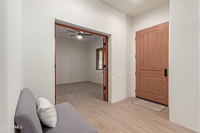 entryway with light hardwood / wood-style flooring and ceiling fan