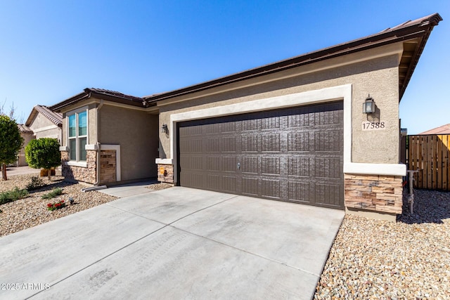 single story home with an attached garage, stone siding, concrete driveway, and stucco siding