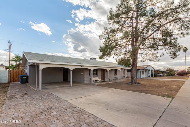 ranch-style home featuring a carport