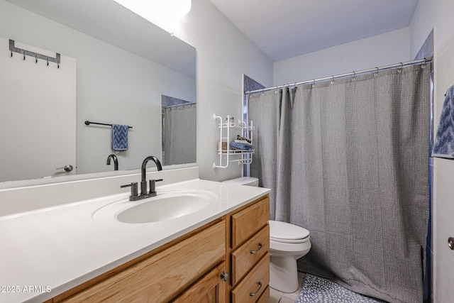 bathroom with toilet and vanity