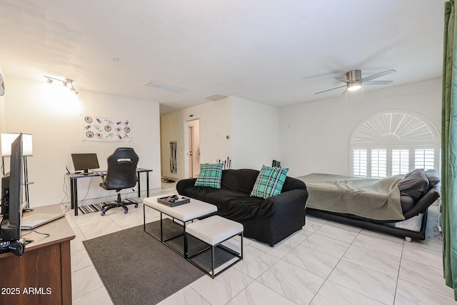 living room with ceiling fan