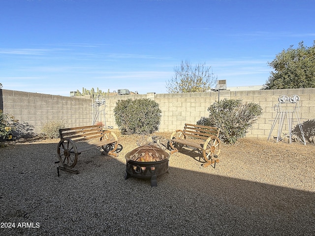 view of yard with an outdoor fire pit