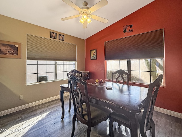 dining area featuring ceiling fan, hardwood / wood-style floors, and vaulted ceiling