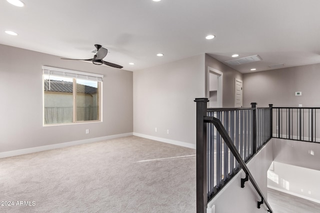 interior space featuring carpet and ceiling fan