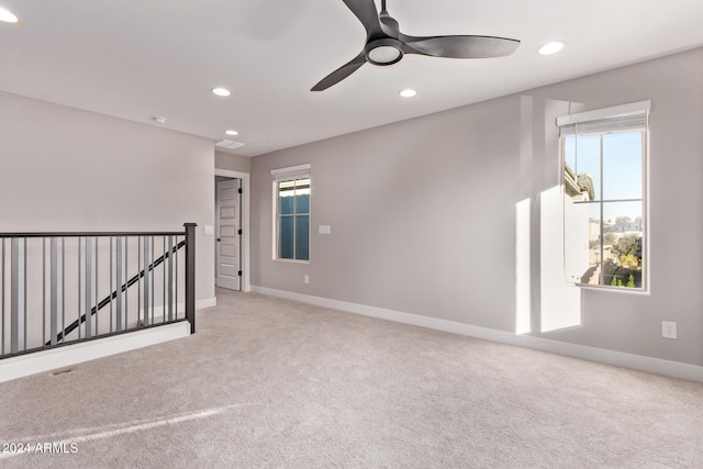 carpeted empty room with ceiling fan