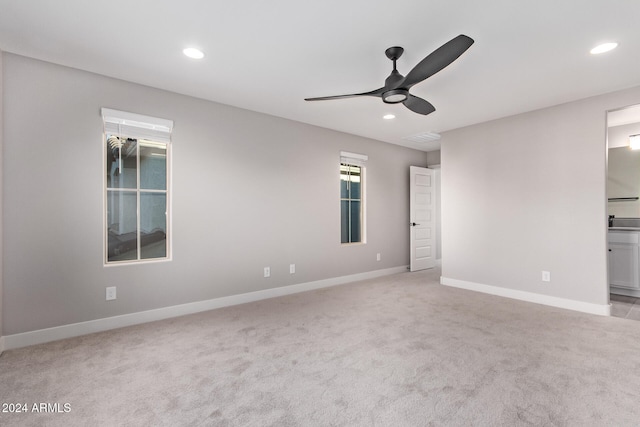 carpeted empty room with ceiling fan