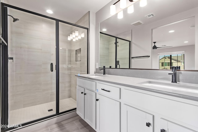 bathroom featuring hardwood / wood-style floors, an enclosed shower, vanity, and ceiling fan