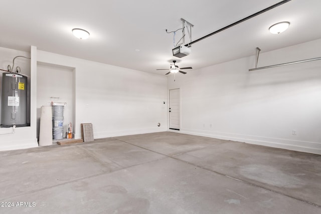 garage featuring water heater, a garage door opener, and ceiling fan