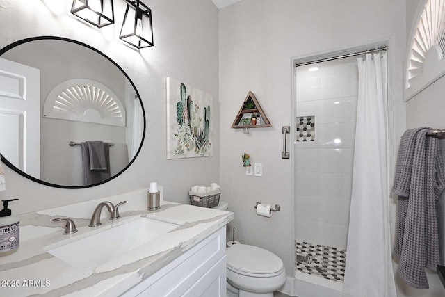 full bathroom with vanity, toilet, and a shower stall