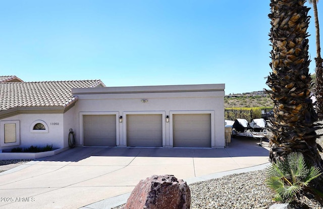 garage featuring driveway