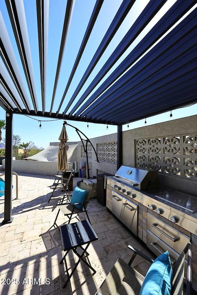 view of patio featuring area for grilling and exterior kitchen