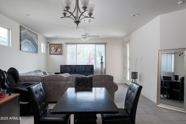 dining room with recessed lighting, plenty of natural light, light tile patterned flooring, and ceiling fan with notable chandelier