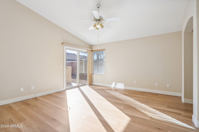 unfurnished room with ceiling fan, light hardwood / wood-style floors, and lofted ceiling