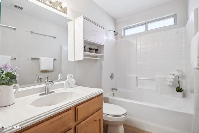 full bathroom with vanity, toilet, and washtub / shower combination