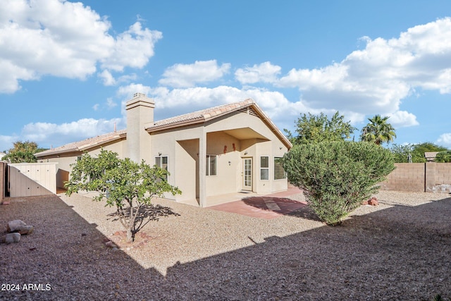 rear view of house with a patio