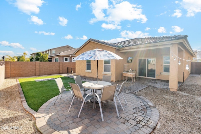 back of property with a patio area