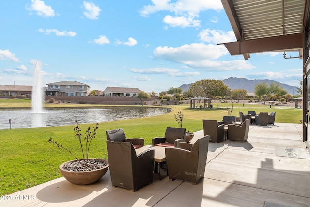 view of patio / terrace with a gazebo and a water and mountain view